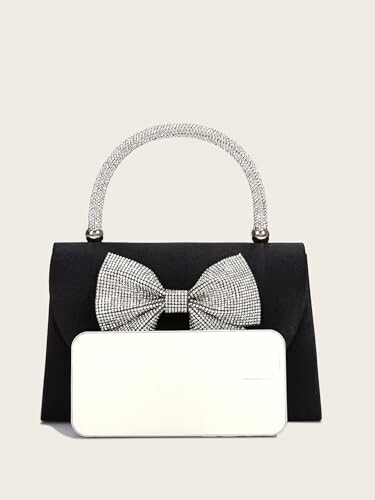 Elegant black handbag with a rhinestone bow and handle.