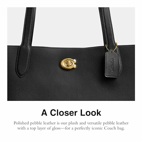 Close-up of black leather Coach bag with gold clasp