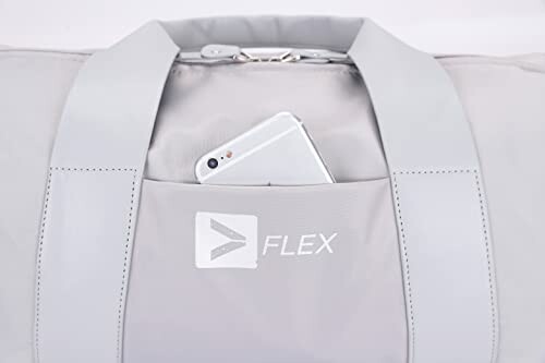 Gray duffel bag with a phone in the pocket