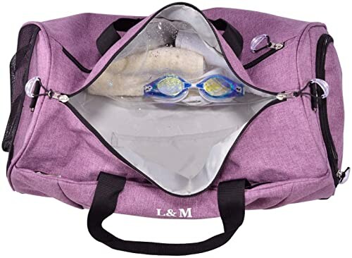 Open purple gym bag with goggles inside.