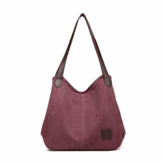 Purple tote bag with brown straps.