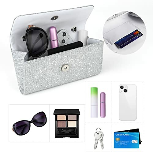 Open sparkly clutch bag with sunglasses, lipstick, makeup, phone, keys, and credit card.