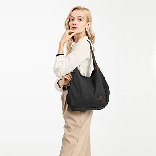 Woman in white shirt with black tote bag.